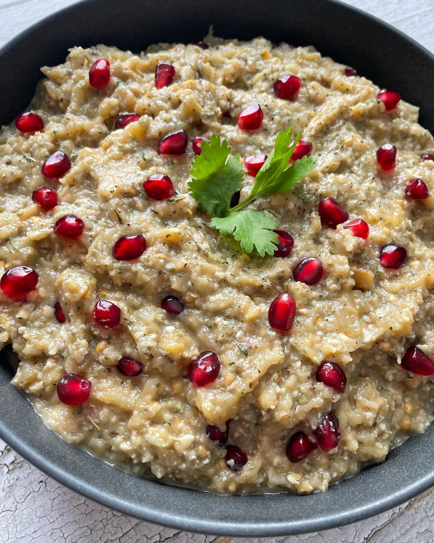 - ππΌπππ ππΌπ½πΌπ½ - THE ULTIMATE #PERSIAN #VEGAN RECIPE
- α΄
α΄/ α΄α΄α΄ΙͺΚ κ°α΄Κ α΄α΄ΚΚα΄Κκ±
Itβs not a regular Kabab recipe post. It's just the name of a totally Persian vegan dish!
The Persian cuisine is extremely rich, & the northern parts of Iran have very unique dishes made with loads of herbs - especially wild & rare ones that not many are familiar with, primarily used as aromatics.
Of major notability, is the herb pronounced as "Choochagh" - or Eryngium Coucasicum. It is a herb used in the northern part of Iran to make "Zeytoon Parvardeh" (a decadent mixture of olives, walnuts, pomegranate molasses, & herbs, and "Morgh e Torsh" - translated as Sour Chicken, with spinach, cilantro, and split peas.
Another fabulous aromatic herb is "Khalvash". Apparently it is a wild variety of the mint family, and the closest translation I could get for it is "Kotkotoo".
SO grateful that I had inventory left from my mom's visit, otherwise this post would be toast!
Now on to the Kaleh Kabab. This vegan decadence is a unique side (or main), and I truly believe the full authentic recipe is still up for debate. My late grandmother and her elder cousins always argued over it!
Here's what I put together from the best of my knowledge and recollection. I hope Iβve made all the Rashti & Pahlavichi folks happy with this post π
I made this with @shallyzomorodi in mind, who is my new distant relative and her heart and soul are deeply entwined with our cuisine! Dear Shally, if you end up checking this out, let me know if you have a different recipe.
You would need:
> 4 eggplants
> 14 walnuts, shelled, pressed
> one small bulb garlic, pressed
> 1 tbsp dried mint
> 1 tbsp dried Khalvash
> 1 tbsp dried Chouchagh
> about half a cup of sour pomegranate juice, or sour grape juice (Aab Ghooreh)
> S&P
> Pomegranate arils for texture & garnish
Slice belly of eggplants, grill on charcoal fire or in the oven. Keep turning the eggplants until all sides are cooked.
Cool down & remove their seeds.
Pulse eggplants in a food processor, then mix in pressed garlic & walnuts, pomegranate juice, S&P. Adjust to taste.
I hope you enjoy this nostalgic goodness as well!