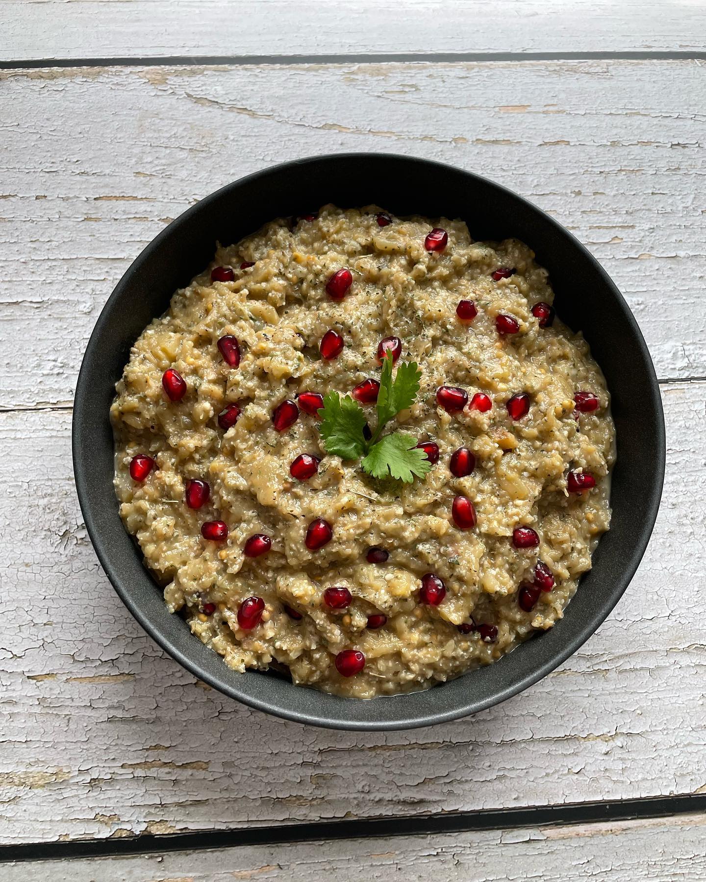 - ππΌπππ ππΌπ½πΌπ½ - THE ULTIMATE #PERSIAN #VEGAN RECIPE
- α΄
α΄/ α΄α΄α΄ΙͺΚ κ°α΄Κ α΄α΄ΚΚα΄Κκ±
Itβs not a regular Kabab recipe post. It's just the name of a totally Persian vegan dish!
The Persian cuisine is extremely rich, & the northern parts of Iran have very unique dishes made with loads of herbs - especially wild & rare ones that not many are familiar with, primarily used as aromatics.
Of major notability, is the herb pronounced as "Choochagh" - or Eryngium Coucasicum. It is a herb used in the northern part of Iran to make "Zeytoon Parvardeh" (a decadent mixture of olives, walnuts, pomegranate molasses, & herbs, and "Morgh e Torsh" - translated as Sour Chicken, with spinach, cilantro, and split peas.
Another fabulous aromatic herb is "Khalvash". Apparently it is a wild variety of the mint family, and the closest translation I could get for it is "Kotkotoo".
SO grateful that I had inventory left from my mom's visit, otherwise this post would be toast!
Now on to the Kaleh Kabab. This vegan decadence is a unique side (or main), and I truly believe the full authentic recipe is still up for debate. My late grandmother and her elder cousins always argued over it!
Here's what I put together from the best of my knowledge and recollection. I hope Iβve made all the Rashti & Pahlavichi folks happy with this post π
I made this with @shallyzomorodi in mind, who is my new distant relative and her heart and soul are deeply entwined with our cuisine! Dear Shally, if you end up checking this out, let me know if you have a different recipe.
You would need:
> 4 eggplants
> 14 walnuts, shelled, pressed
> one small bulb garlic, pressed
> 1 tbsp dried mint
> 1 tbsp dried Khalvash
> 1 tbsp dried Chouchagh
> about half a cup of sour pomegranate juice, or sour grape juice (Aab Ghooreh)
> S&P
> Pomegranate arils for texture & garnish
Slice belly of eggplants, grill on charcoal fire or in the oven. Keep turning the eggplants until all sides are cooked.
Cool down & remove their seeds.
Pulse eggplants in a food processor, then mix in pressed garlic & walnuts, pomegranate juice, S&P. Adjust to taste.
I hope you enjoy this nostalgic goodness as well!